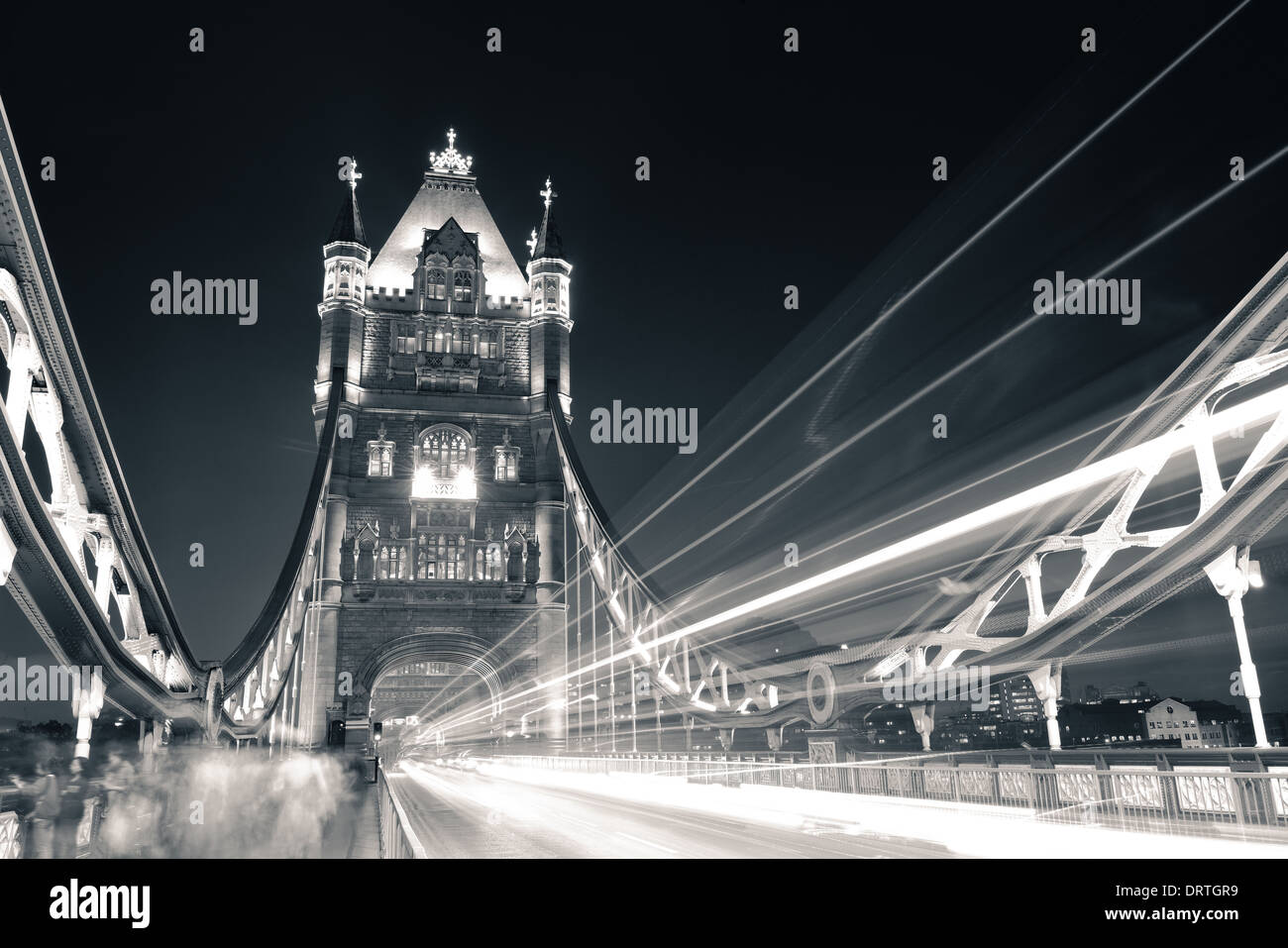 Tower Bridge in London with busy traffic at night Stock Photo - Alamy