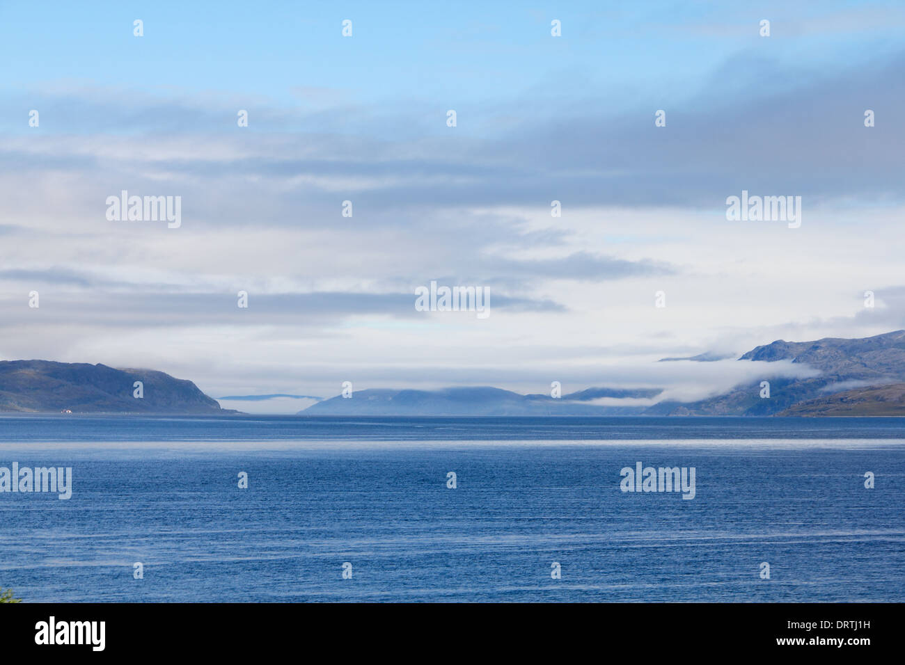 View of bay, blouds and mountains in northern Norway Stock Photo