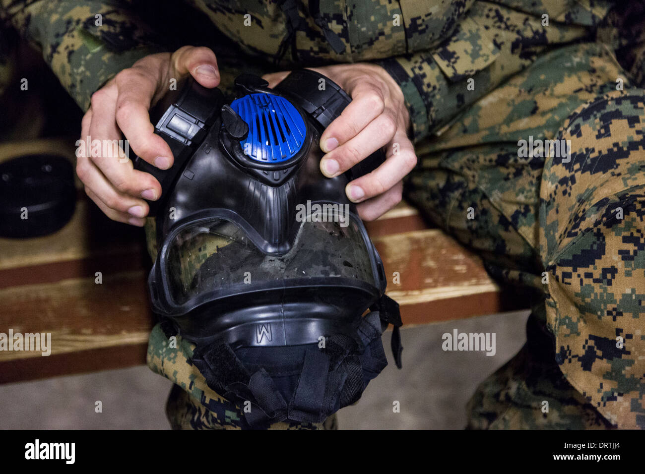US Marine recruits are trained in proper use of their gas mask during boot camp January 13, 2014 in Parris Island, SC. Stock Photo