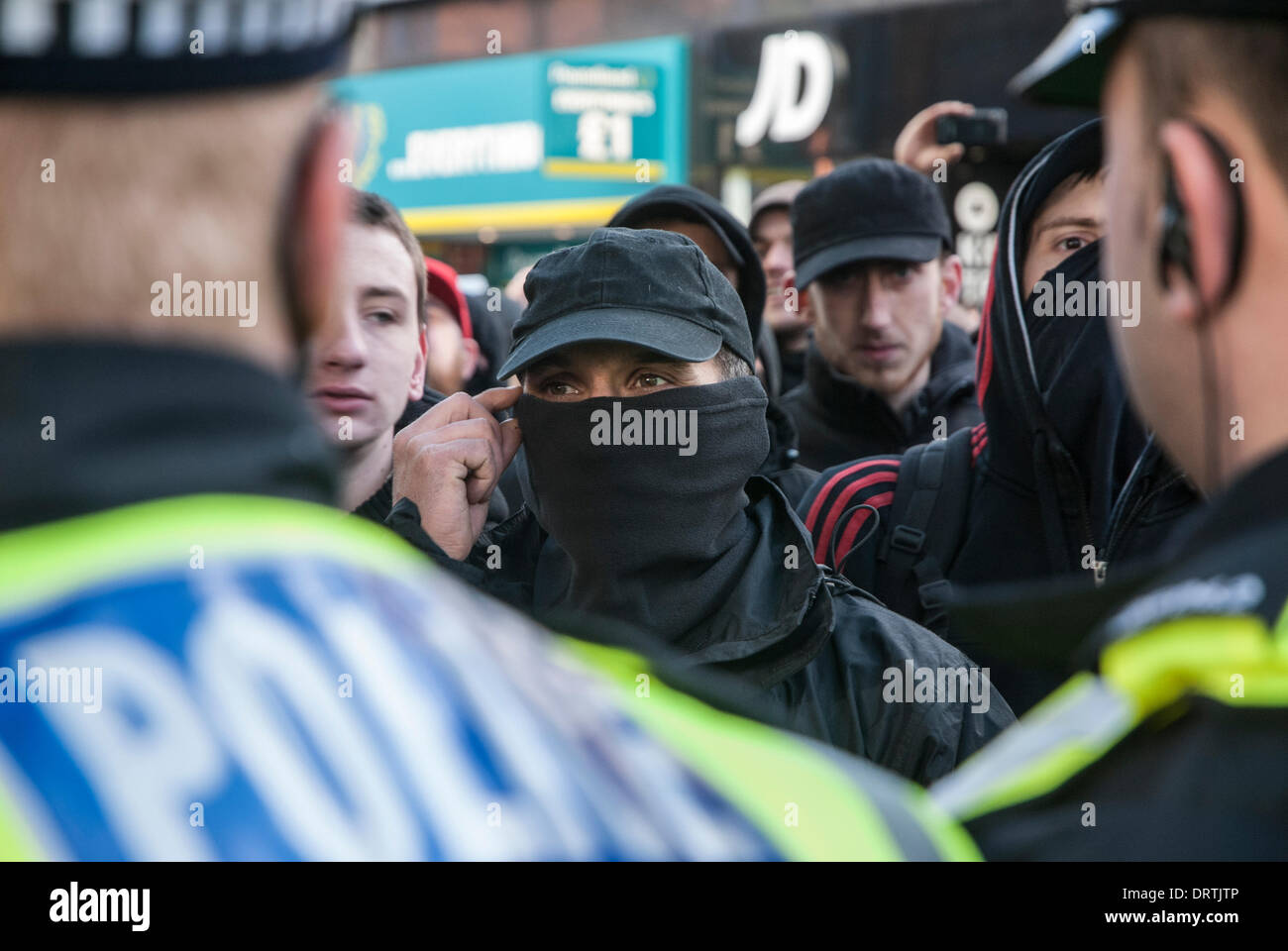 Slough, UK . 01st Feb, 2014. Anti-fascist counter-protesters are held behind police lines as the English Defence League holds a rally in Slough town centre, United Kingdom. Credit:  Peter Manning/Alamy Live News Stock Photo