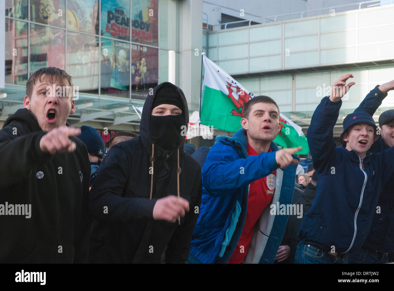 Slough, UK . 01st Feb, 2014. English Defence League supporters make gestures toward anti-fascist counter protesters in Slough town centre, United Kingdom. Credit:  Peter Manning/Alamy Live News Stock Photo