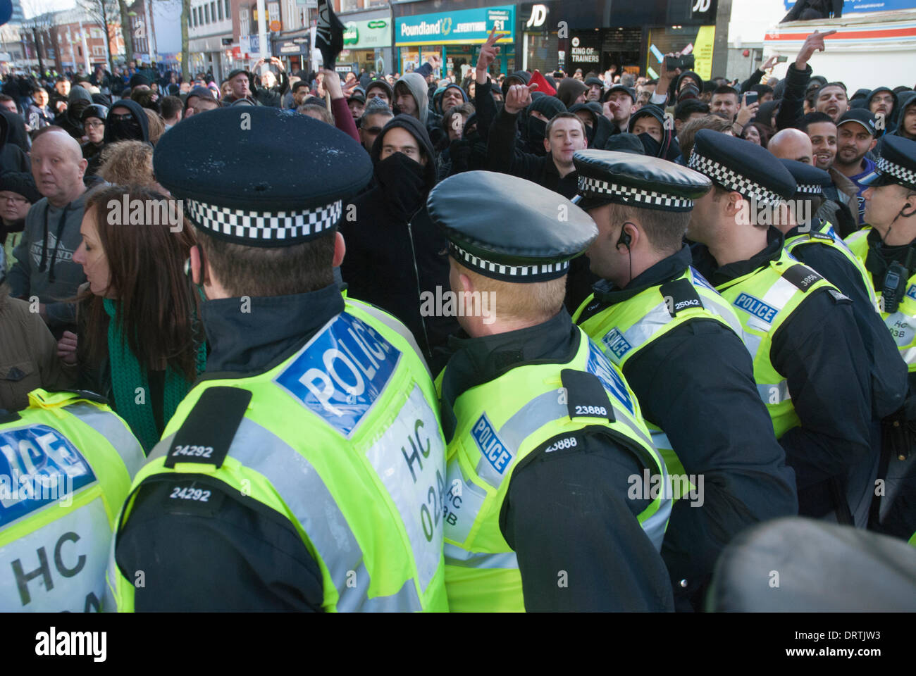 Slough, UK . 01st Feb, 2014. Anti-fascist counter-protesters are held behind police lines as the English Defence League holds a rally in Slough town centre, United Kingdom. Credit:  Peter Manning/Alamy Live News Stock Photo