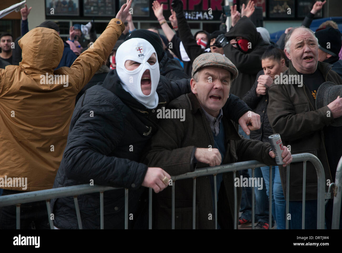 Slough, UK . 01st Feb, 2014. English Defence League supporters direct there attention toward anti-fascist counter protesters in Slough town centre, United Kingdom. Credit:  Peter Manning/Alamy Live News Stock Photo