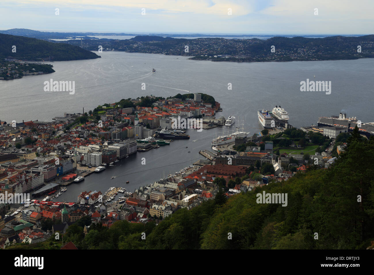 View over Bergen city, the harbour, and fjords, from Mount Fløyen in Norway. Stock Photo