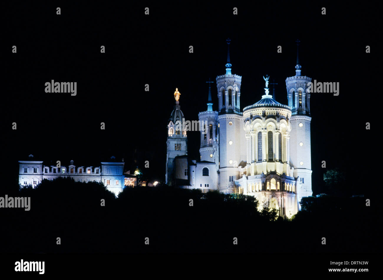 Lyon France Notre-Dame De Fourviere with the Chapelle de La Vierge At Night Stock Photo