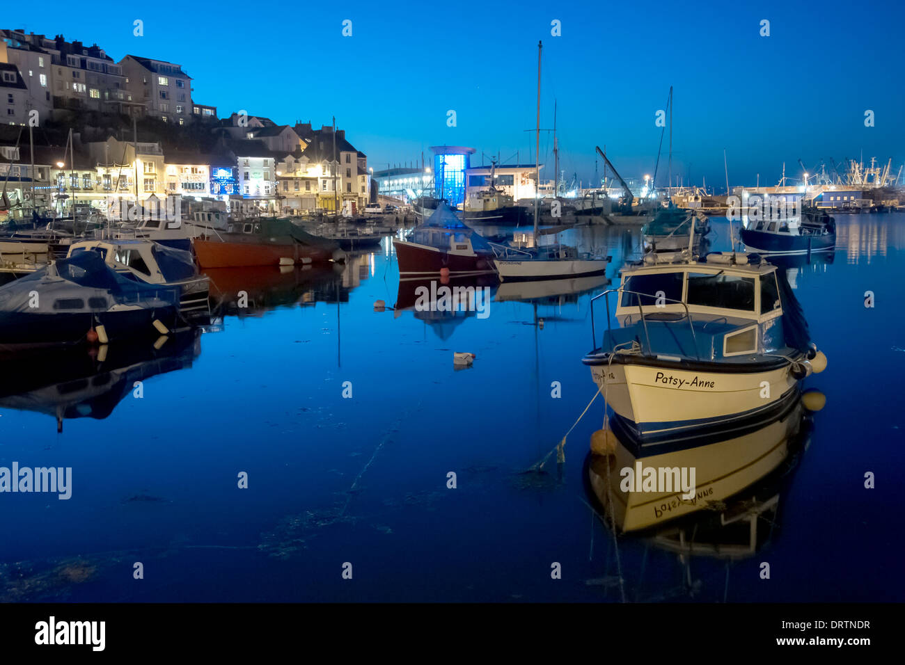Evening image of the inner harbour at the historic commercial fishing port of Brixham in South Devon. Stock Photo