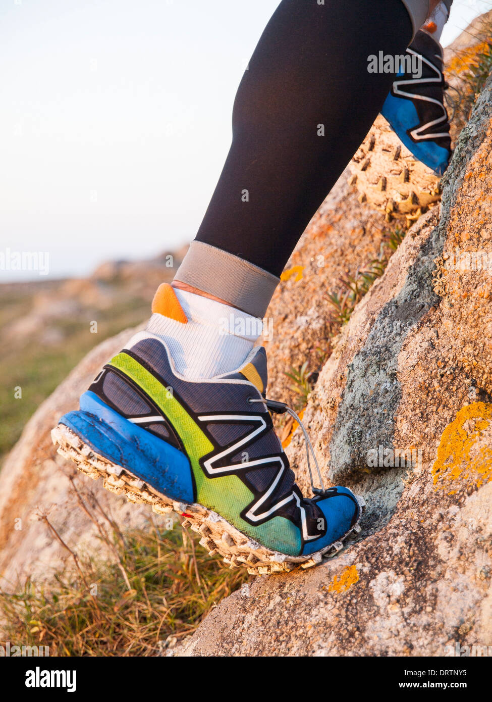 Extreme sports shoes for trail running practice in nature. Stock Photo