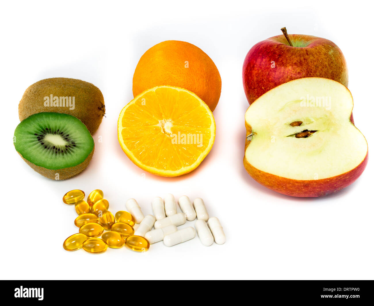 Various vitamin-rich fruits and vitamin tablets Stock Photo