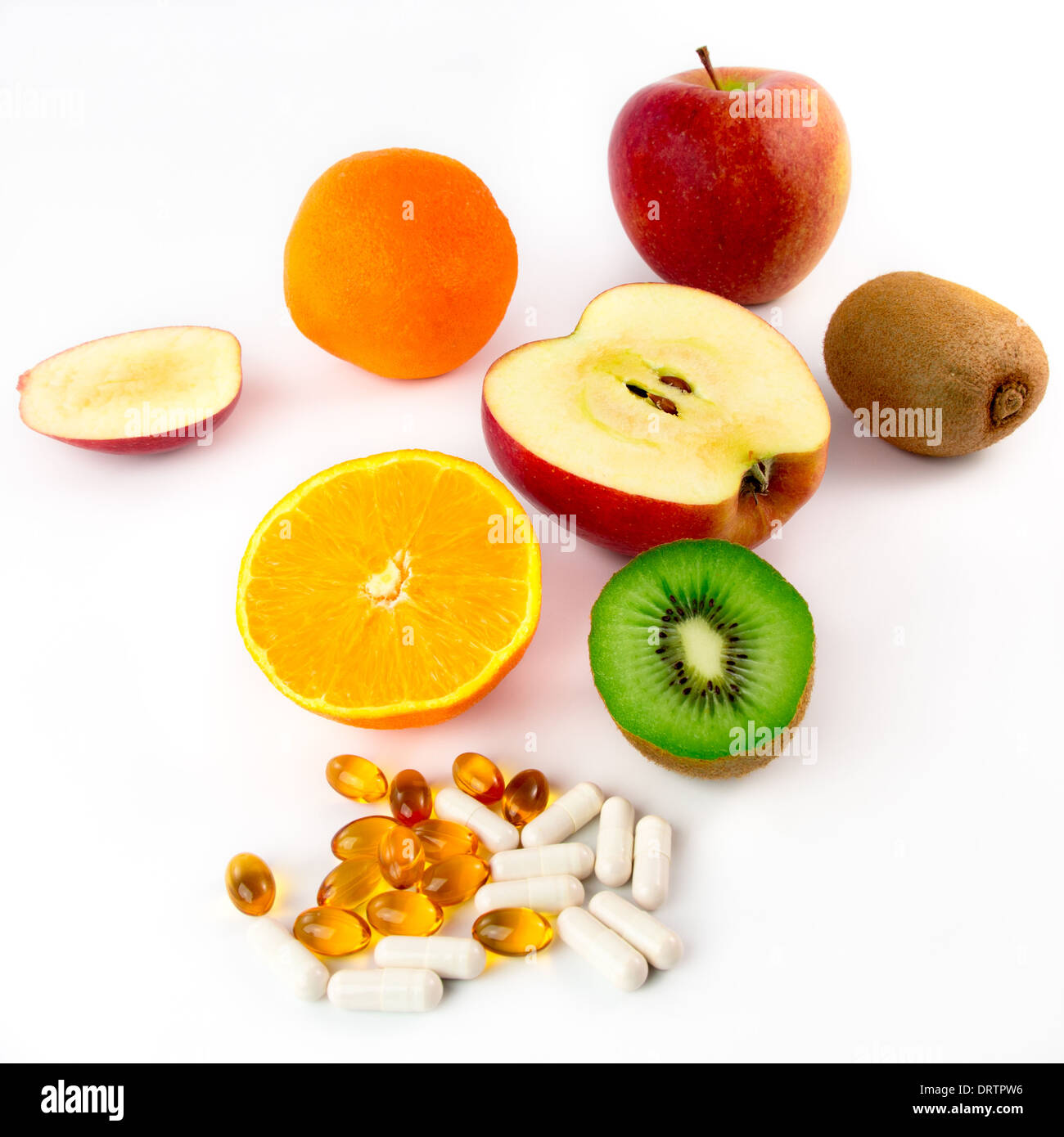 Various vitamin-rich fruits and vitamin tablets Stock Photo