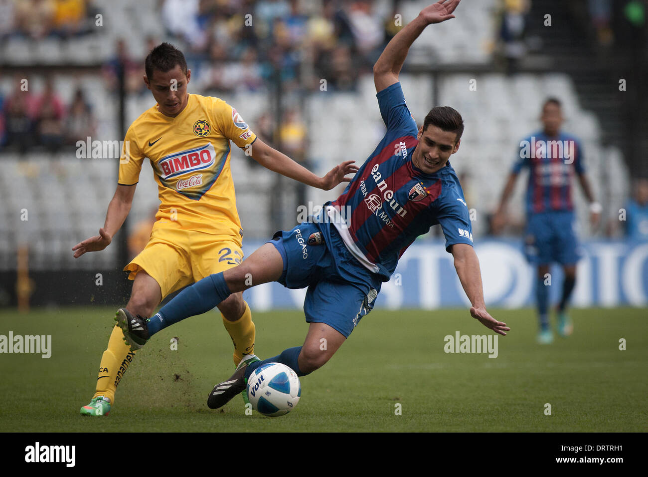 Mexico City, Mexico. 1st Feb, 2014. America's Paul Aguilar (L) vies for the ball with Atlante's Manuel Viniegra (R) during the match of the MX League Closing Tournament 2014, held in the Azteca Stadium in Mexico City, capital of Mexico, on Feb. 1, 2014. Credit:  Pedro Mera/Xinhua/Alamy Live News Stock Photo
