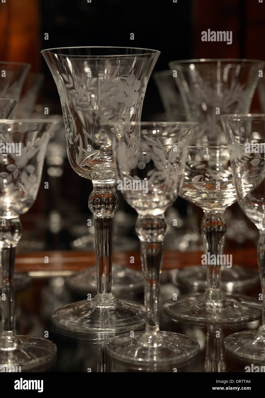 Etched crystal stemware in a wooden display Stock Photo Alamy