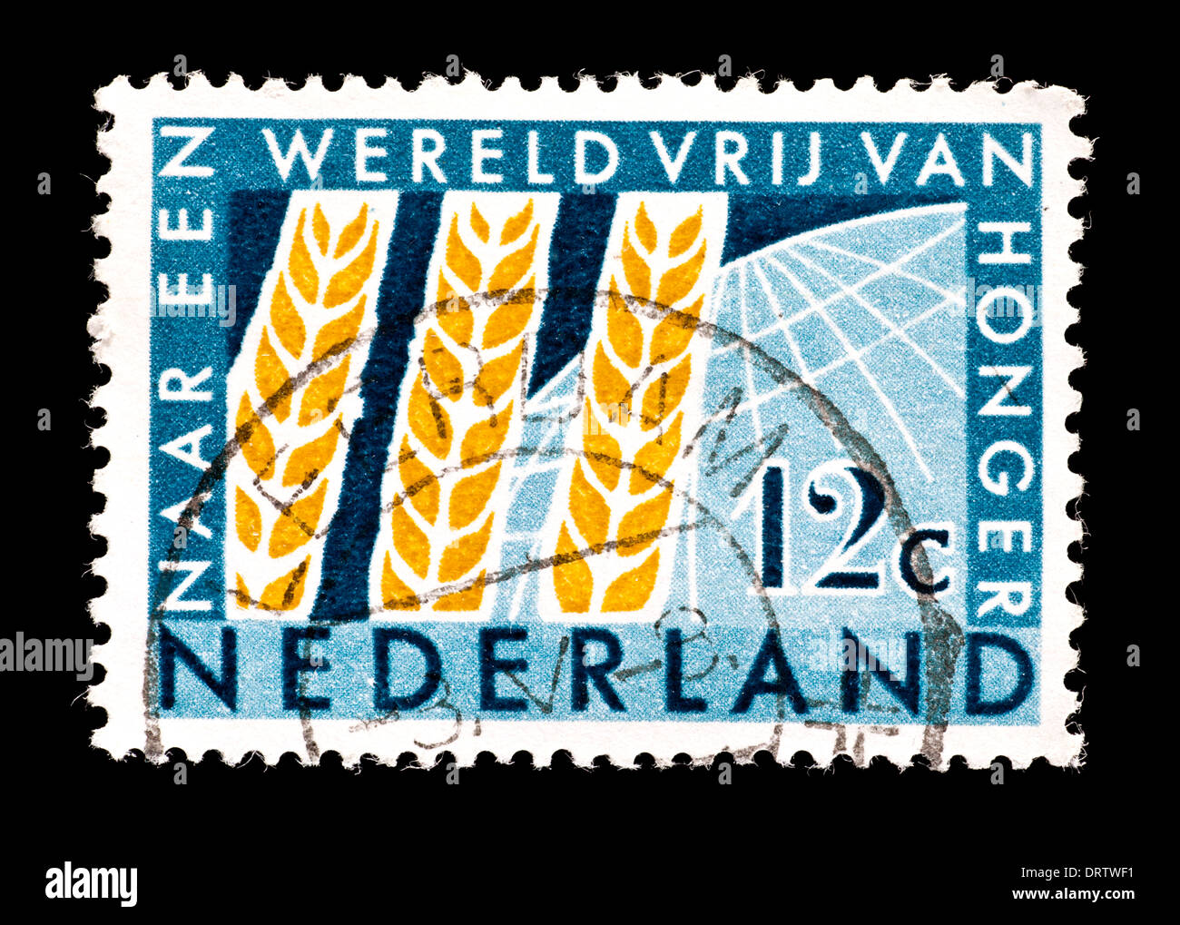 Postage stamp from the Netherlands depicting wheat emblem and globe, for the FAO Freedom from Hunger campaign. Stock Photo