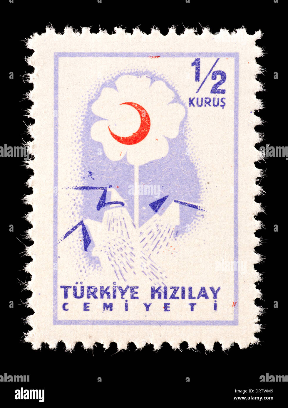 Postage tax stamp from Turkey depicting a flower and red crescent. Stock Photo