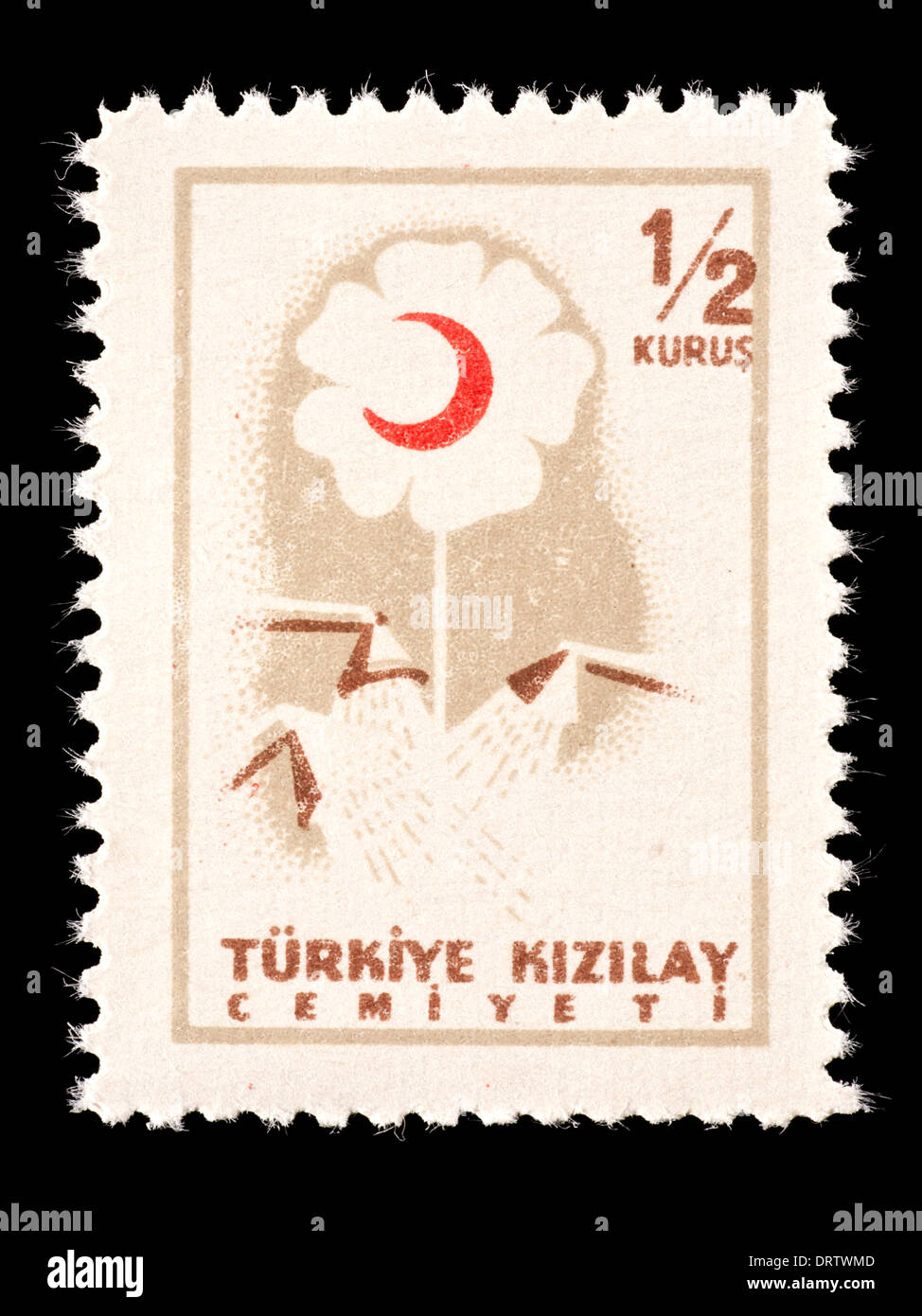 Postal tax stamp from Turkey depicting a flower and red crescent. Stock Photo