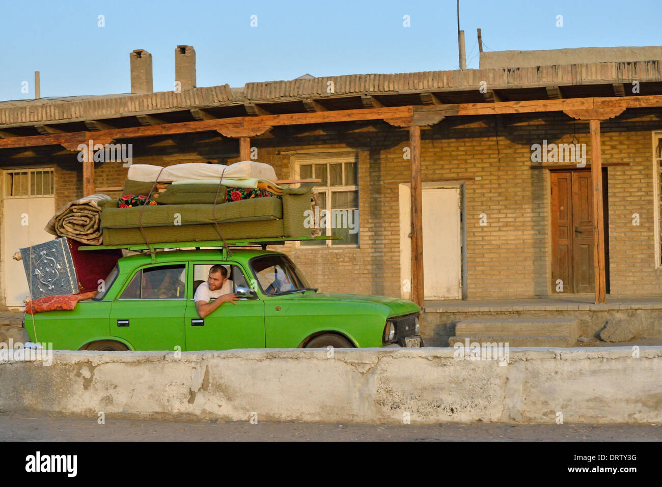 Overloaded old Lada car, Bukhara, Uzbekistan Stock Photo - Alamy