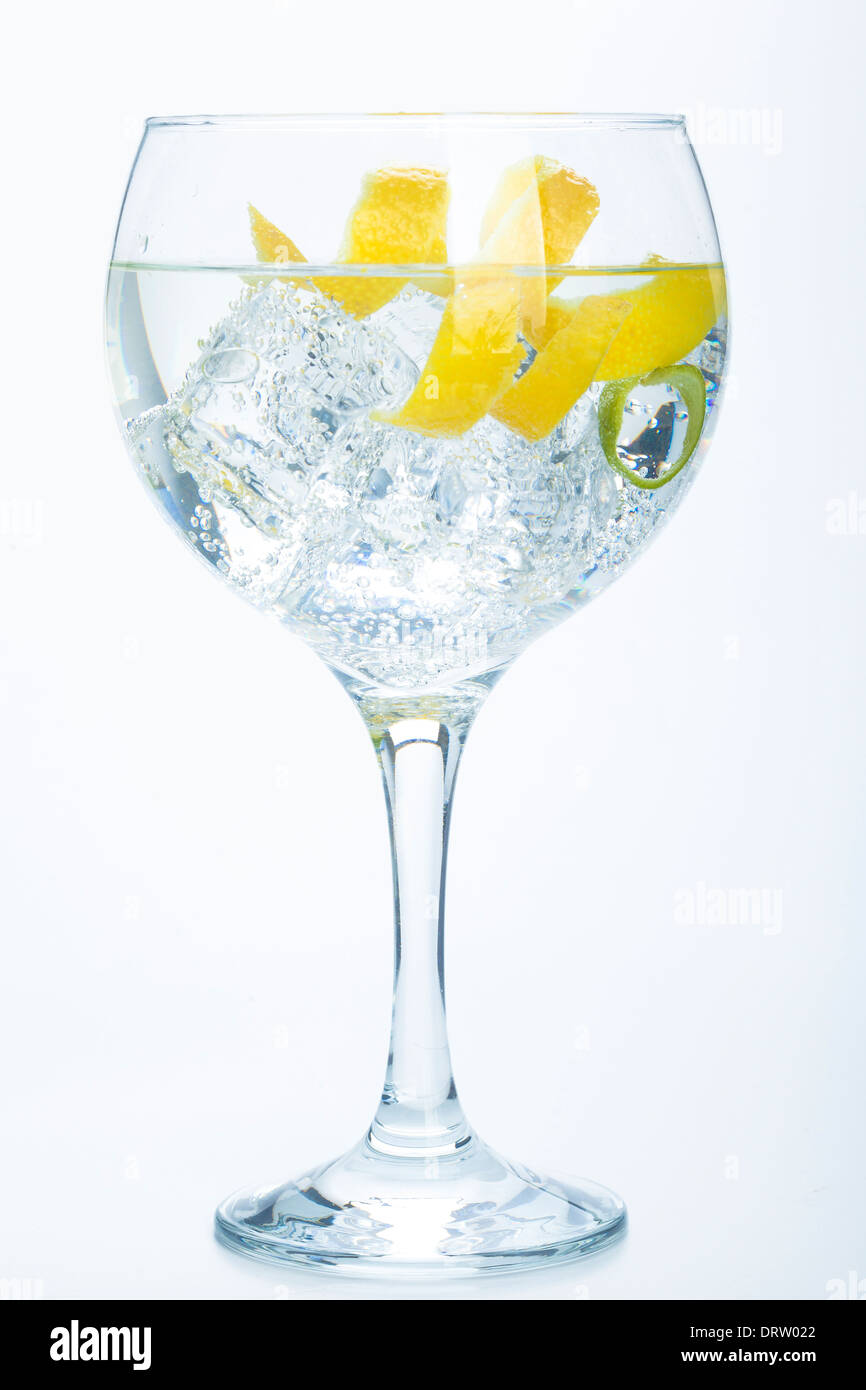 orange lemon and lime gin tonic isolated over white background Stock Photo