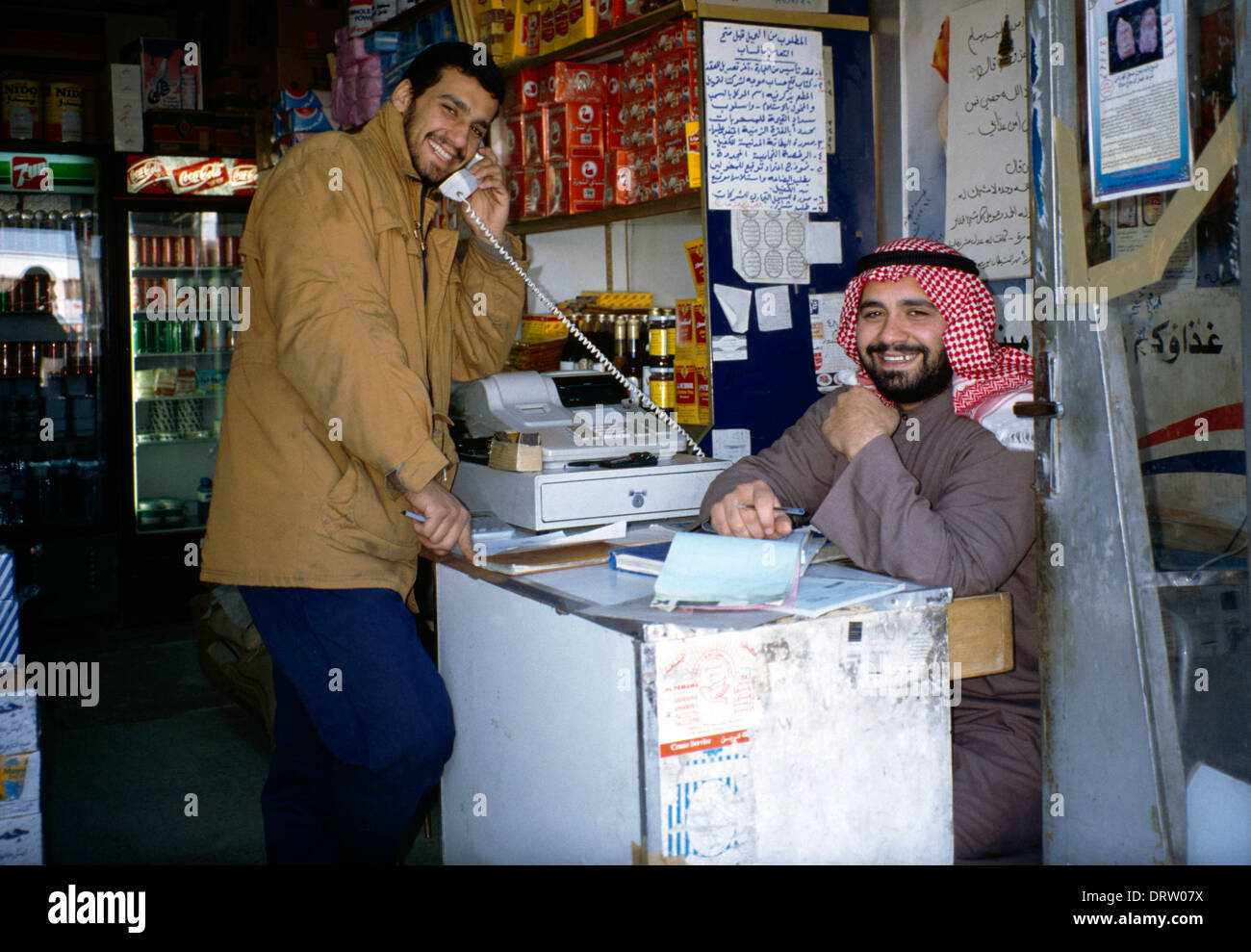 Two Smiling Men in a shop in the Souk Kuwait Stock Photo