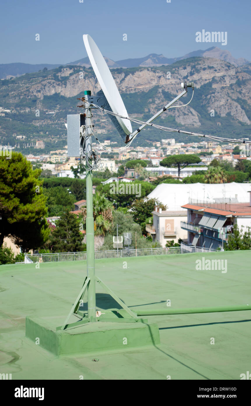 A satellite receiver dish on the roof of a hotel in Sant' Agnello near Sorrento, Italy. Stock Photo