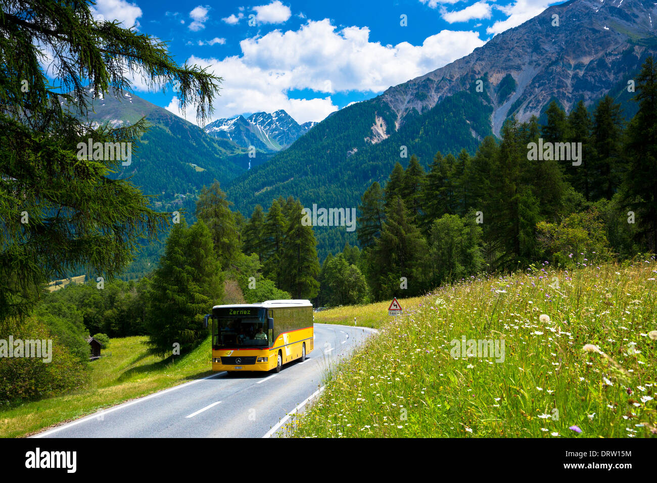 Touring coach on touring holiday in the Swiss Alps, Swiss National Park, Switzerland Stock Photo