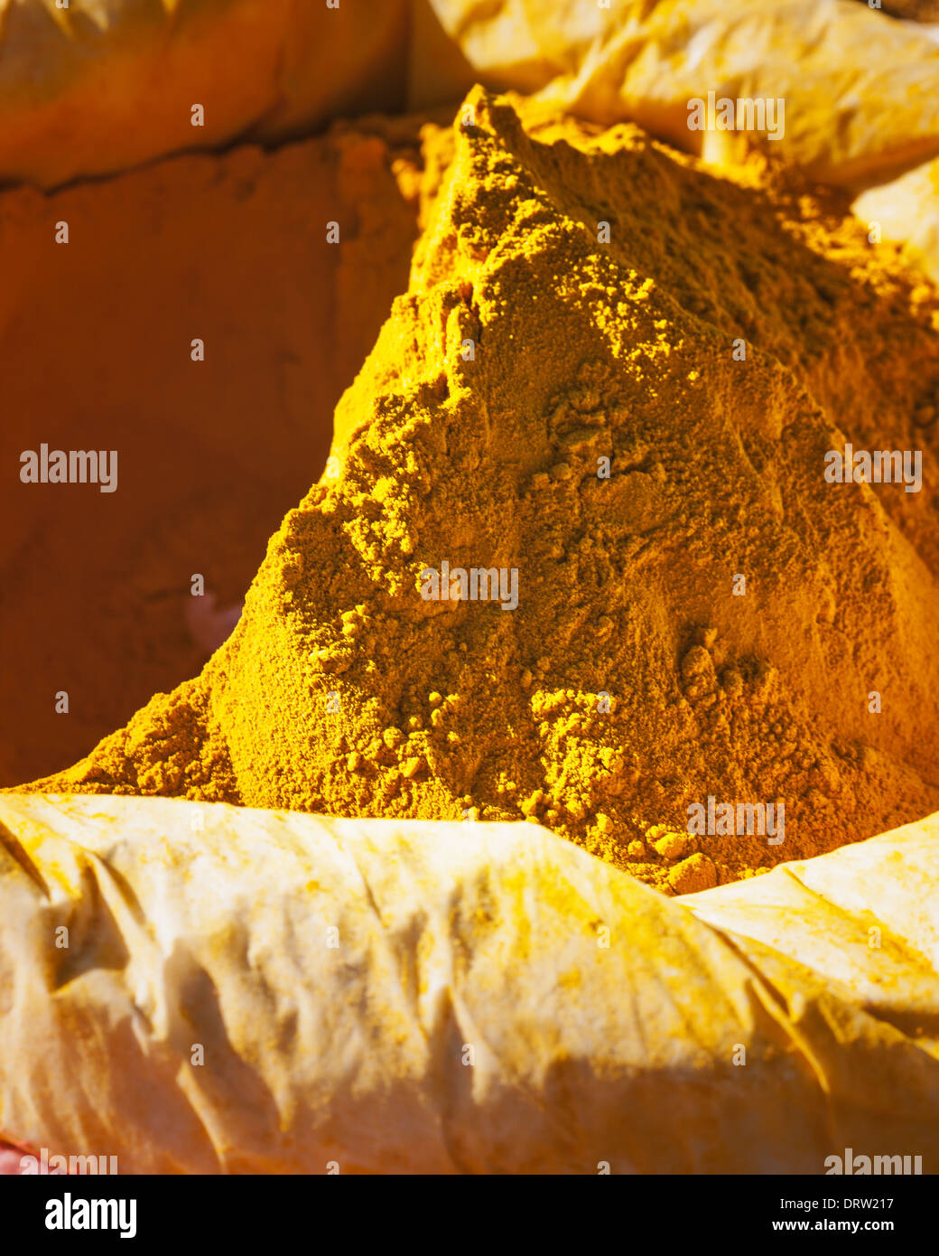 Curry powder, mixture of spices, in sack at a farmers market Stock Photo