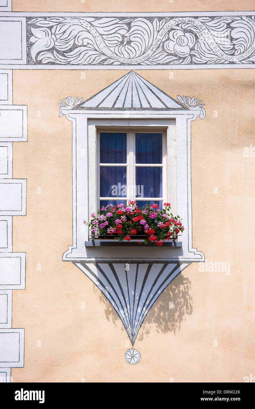 Oriel window sgraffito design on a traditional house in Mustair, Switzerlan Stock Photo