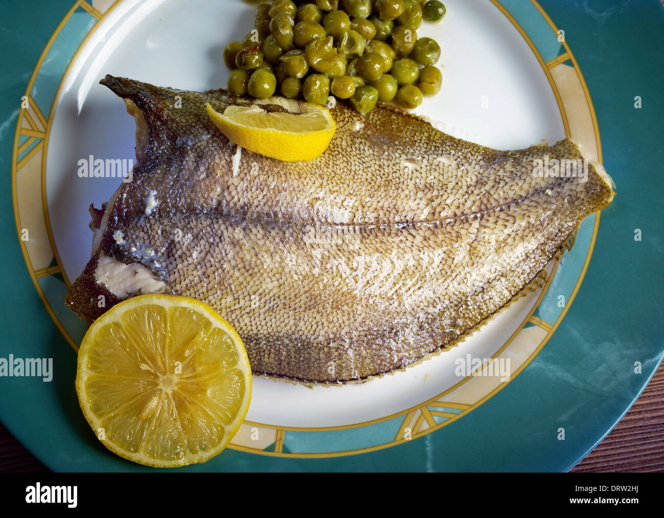 Baked Flounder with vegetables and lemon Stock Photo Alamy