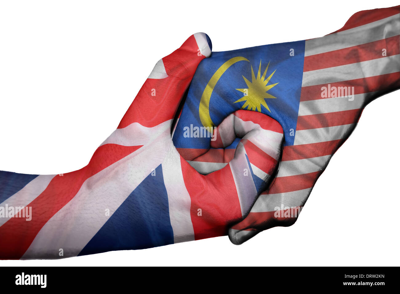 Diplomatic handshake between countries: flags of United Kingdom and Malaysia overprinted the two hands Stock Photo