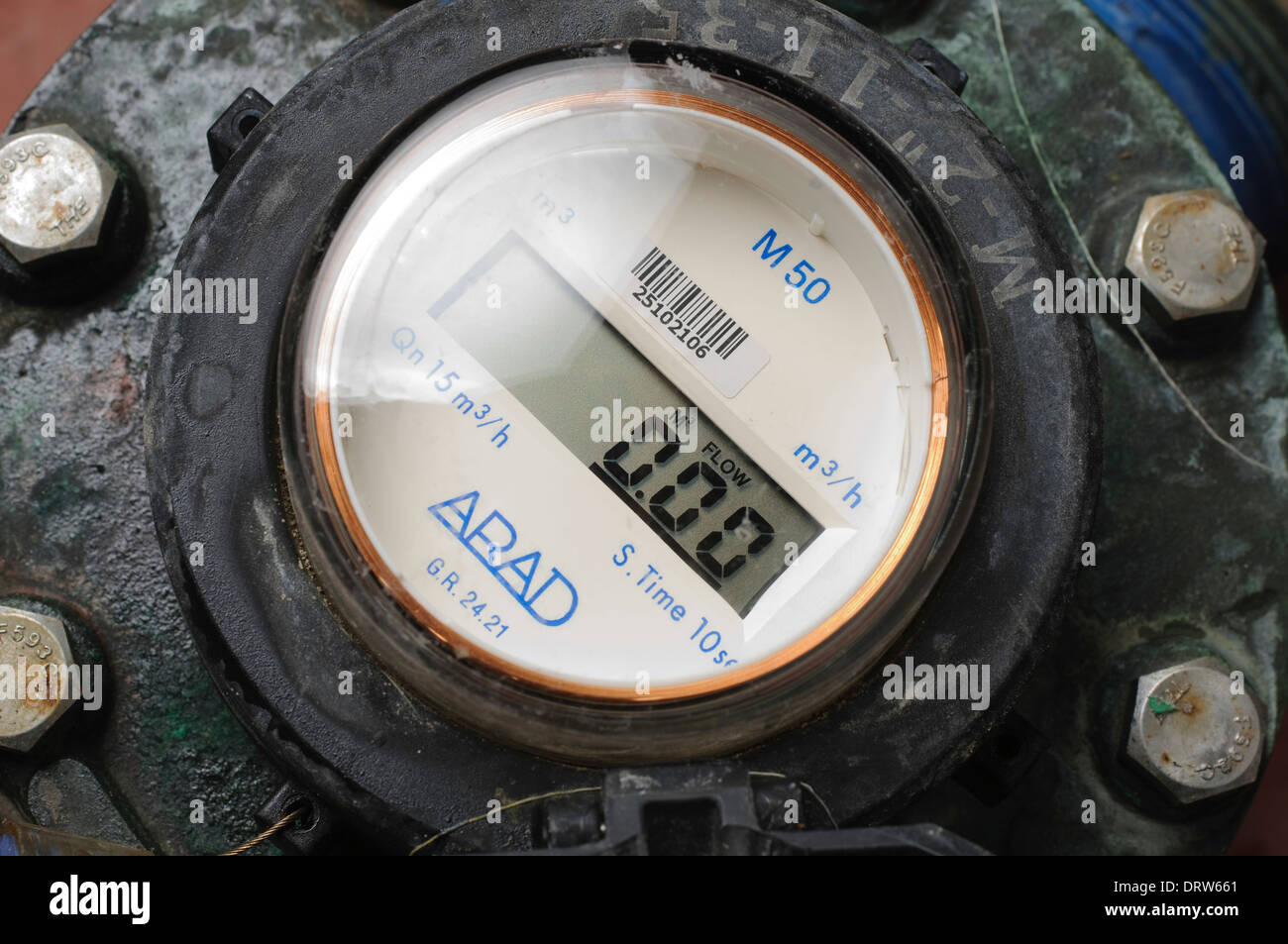 Water flow meter with digital display measures the hourly flow of the water in cubic metres Stock Photo
