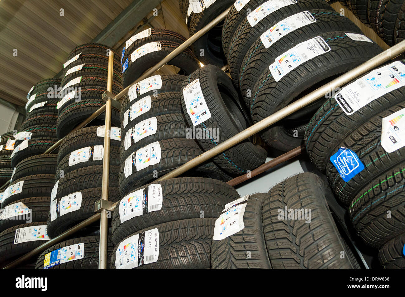 Car tires are being stored in a garage. Stock Photo