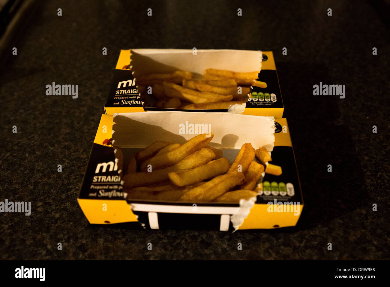 Microwave potato chips frozen fries boxes box Stock Photo