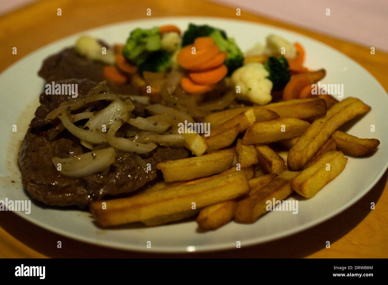 plate tray Fries potato steak meat vegetables Stock Photo