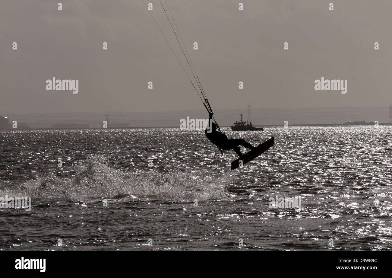 Kite surfer leaping out of the water Stock Photo