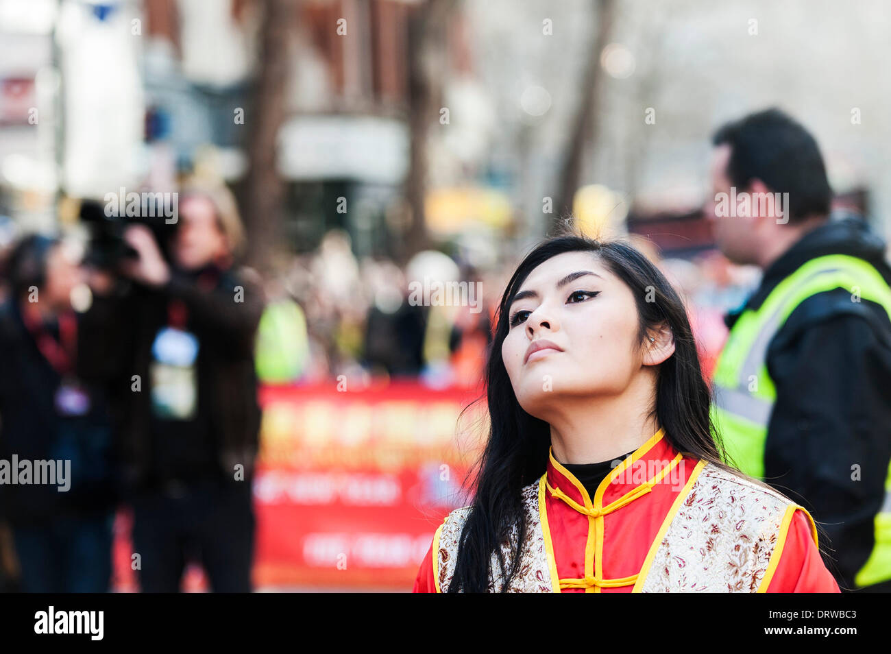 Charing Cross Rd, London, UK. 2nd February 2014. An attractive Chinese woman celebrating the Chinese New Year, the Year of the Horse. Credit:  Gordon Scammell/Alamy Live News Stock Photo