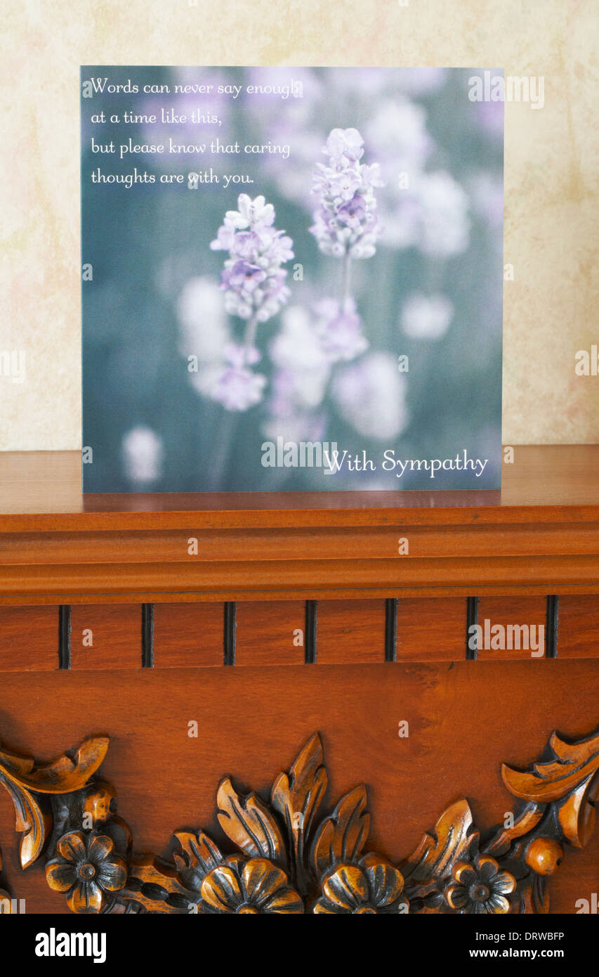 With Sympathy card on mantelpiece in lounge Stock Photo