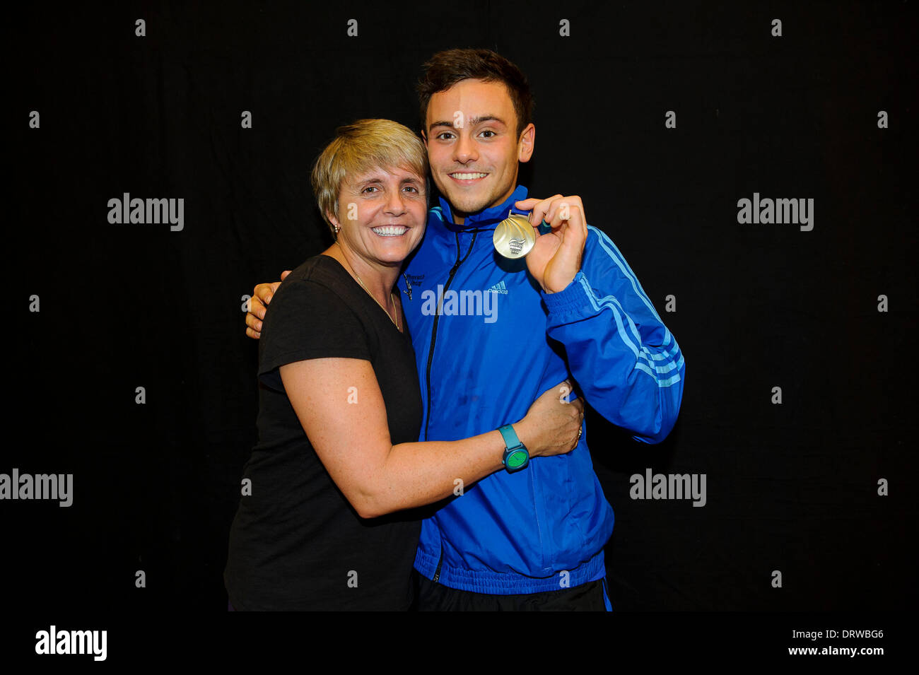 Southend-on-Sea, UK. 02nd Feb, 2014. Tom Daley of Plymouth Diving poses with his Gold winners medal from the Mens 10m Platform Final and his new coach Jane Figueiredo, head of the new high performance diving centre in London, on Day 3 of the British Gas Diving National Cup 2014 from Southend Swimming and Diving Centre. Credit:  Action Plus Sports/Alamy Live News Stock Photo
