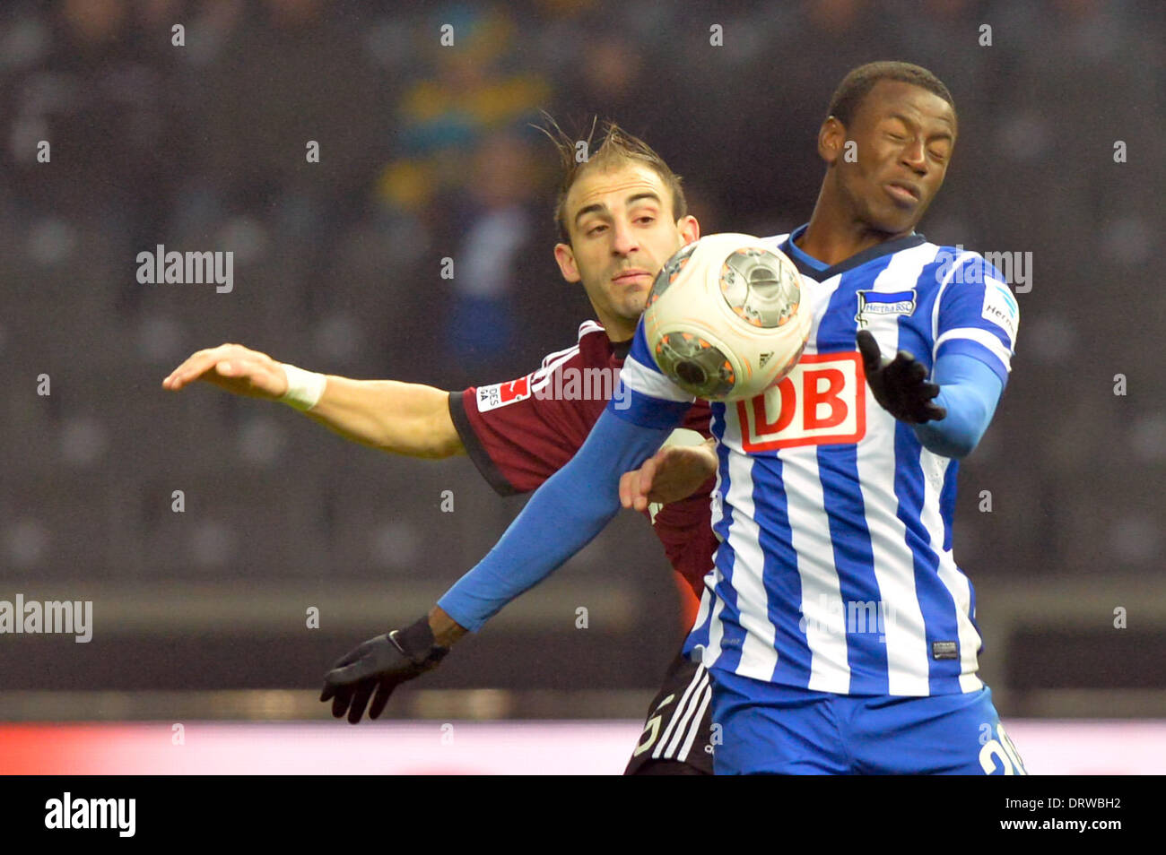 Berlin, Germany. 02nd Feb, 2014. Hertha's Adrian Ramos (R) and Nuremberg's Javier Pinola vie for the ball during the Bundesliga soccer match between Hertha BSC and 1. FC Nuremberg in the Olympic Stadion in Berlin, Germany, 02 February 2014.Photo: Marc Tirl/dpa (ATTENTION: Due to the accreditation guidelines, the DFL only permits the publication and utilisation of up to 15 pictures per match on the internet and in online media during the match.)/dpa/Alamy Live News Stock Photo