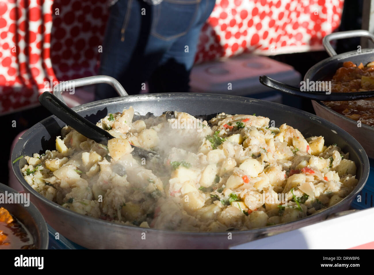 Pan fried Cured Cod Cooking on a Giant wok Stock Photo - Alamy