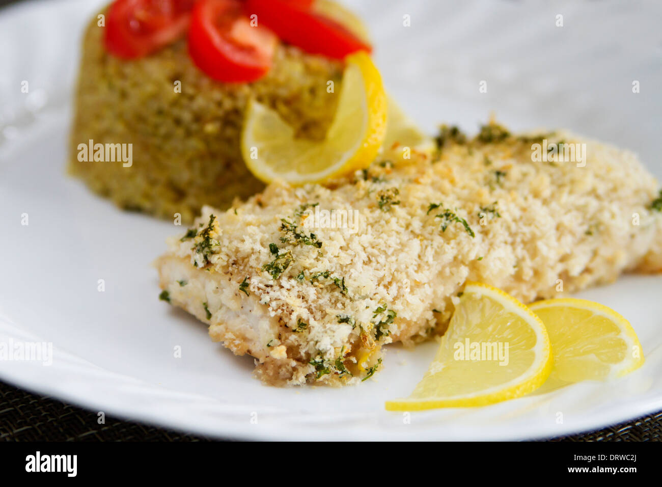 Crispy baked Mahi mahi fish and quinoa Stock Photo - Alamy