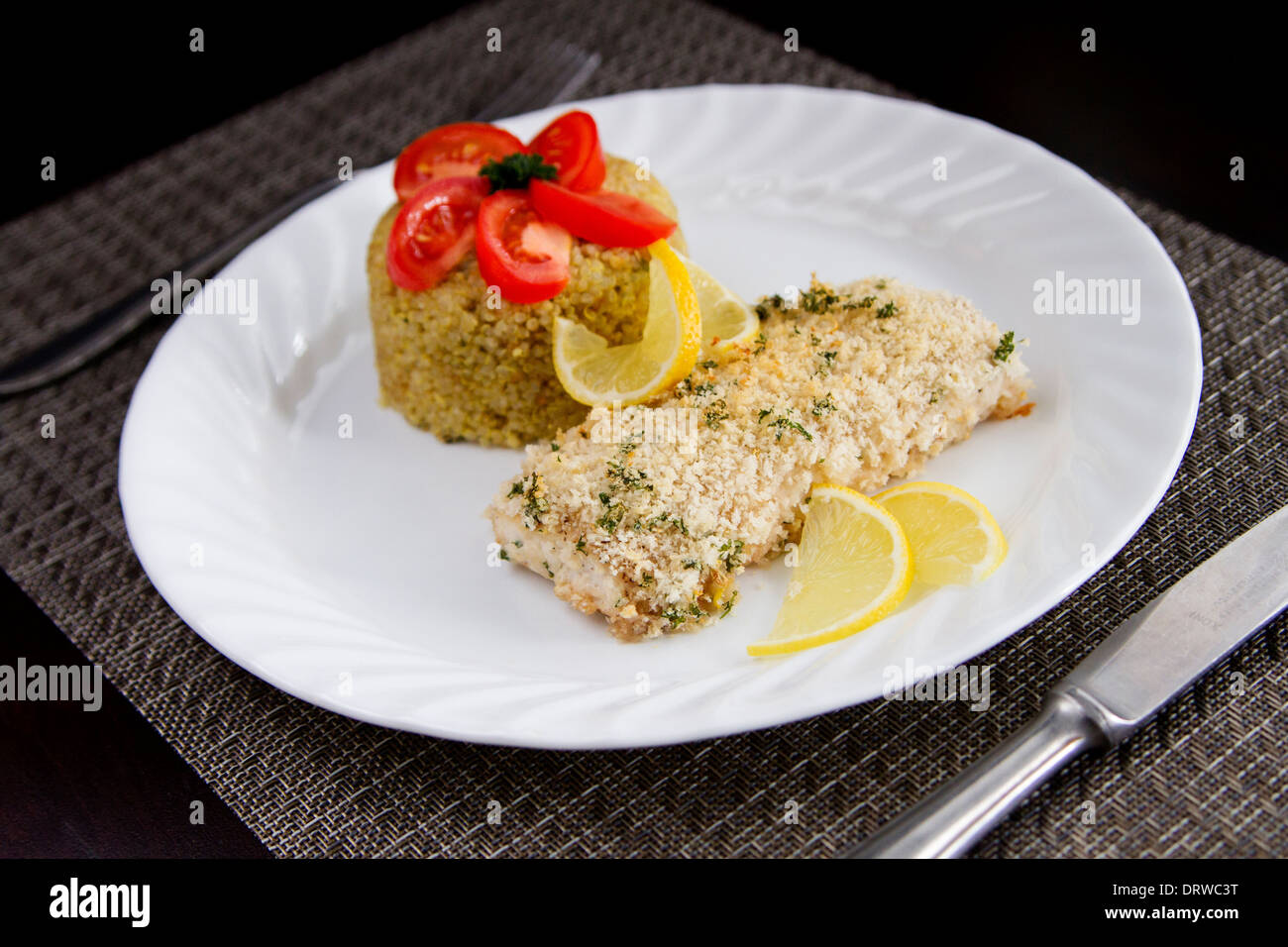 Crispy baked Mahi mahi fish and quinoa Stock Photo - Alamy