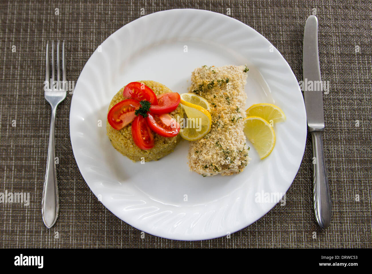 Crispy baked Mahi mahi fish and quinoa Stock Photo - Alamy