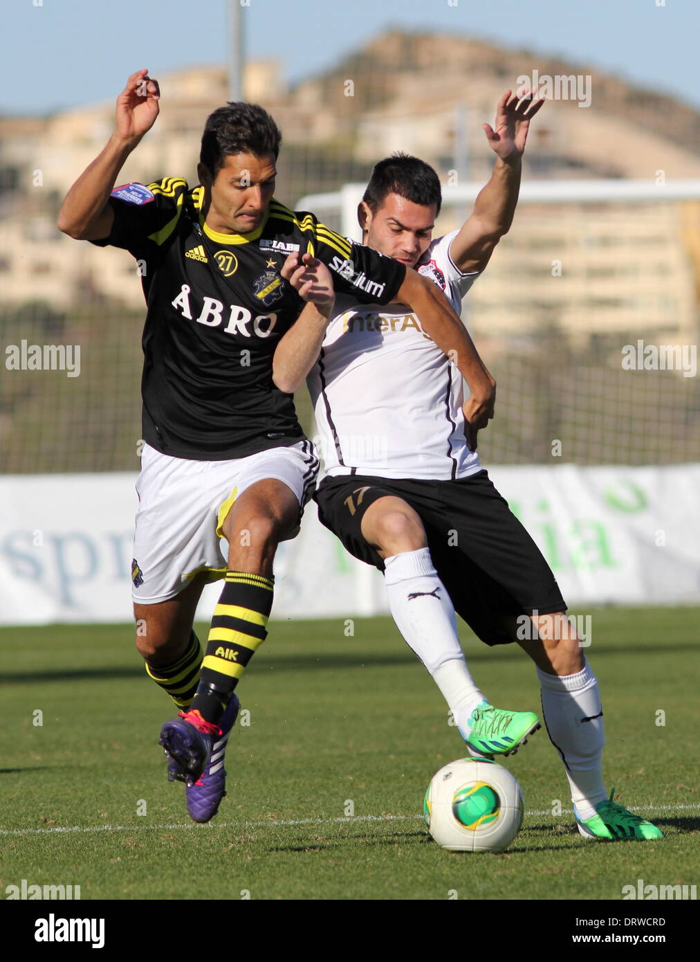 Copa Del Sol, La Manga Club, Spain. 2nd Feb 2014.  FC Astra (Romania) versus AIK (Sweden)  Luarentia Iorga (Astra) is held off by Celso Borges (AIK) during Astra's 1-0 win to maintain their winning run in the competition.  Photograph by Tony Henshaw Stock Photo
