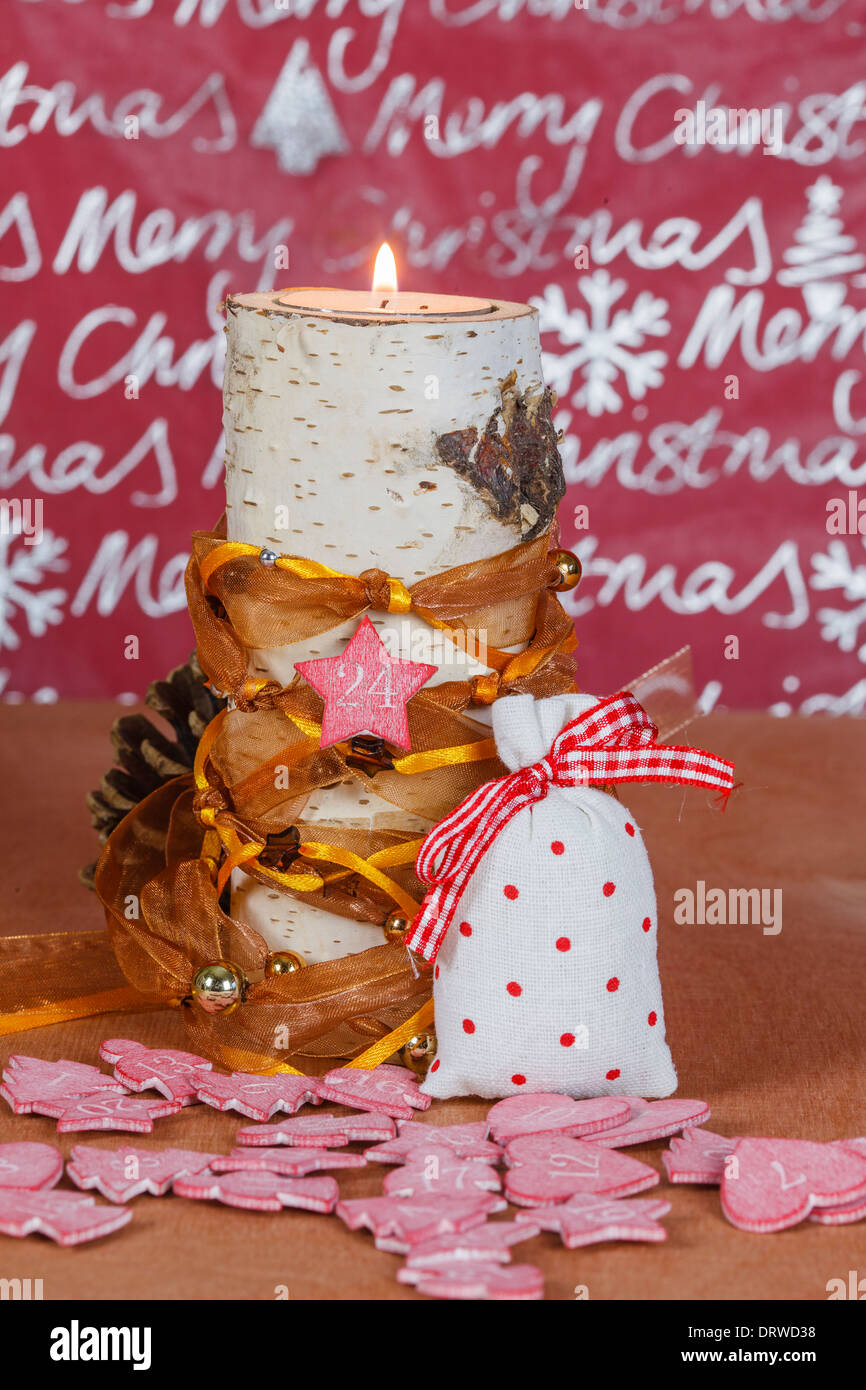 Candle holders made of birch with Christmas decoration Stock Photo
