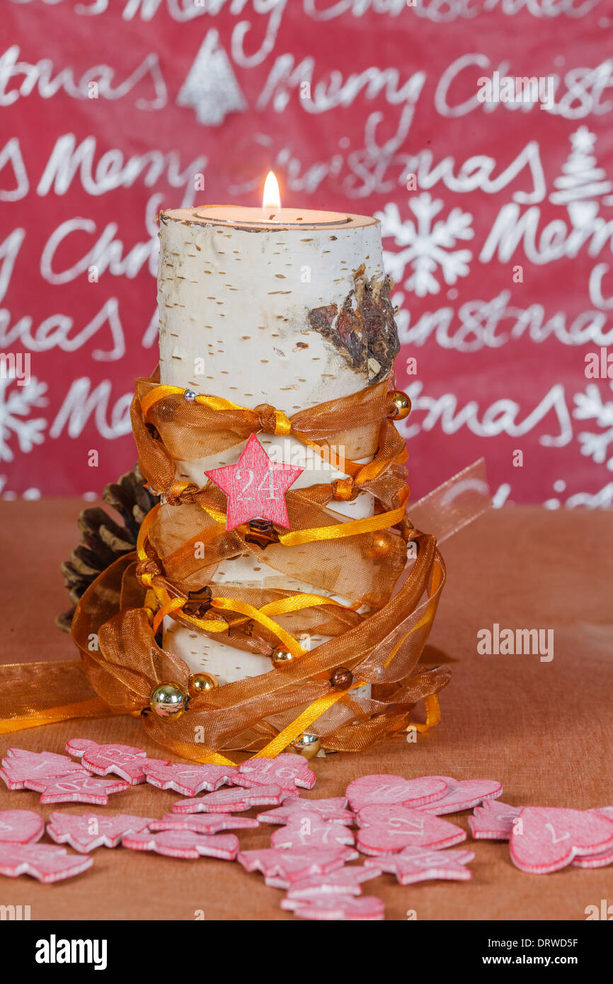 Candle holders made of birch with Christmas decoration Stock Photo