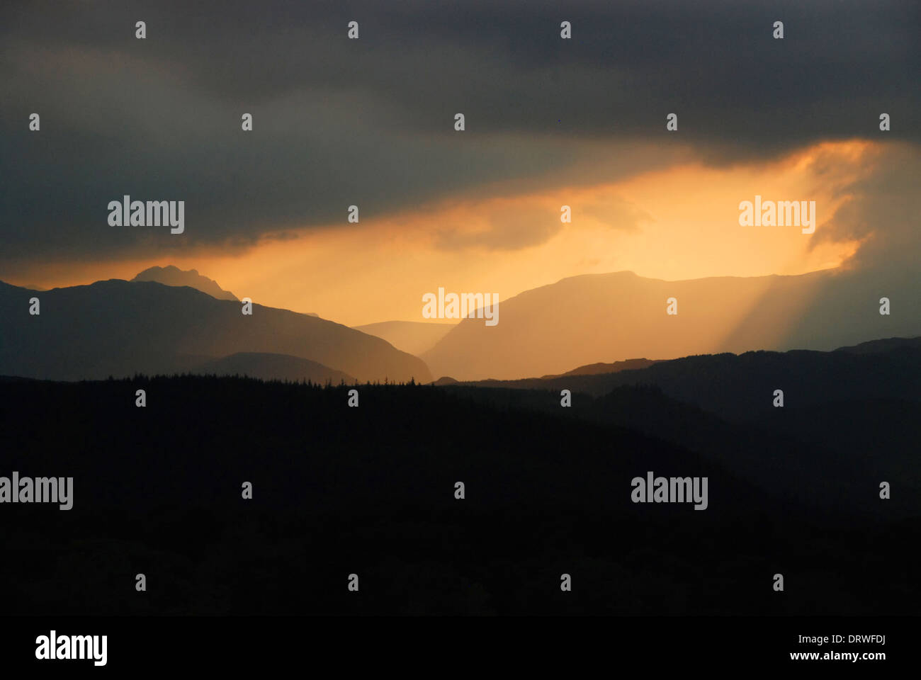 Sunrays lighting up the mountain of Tryfan, in the Snowdonia mountain range Stock Photo