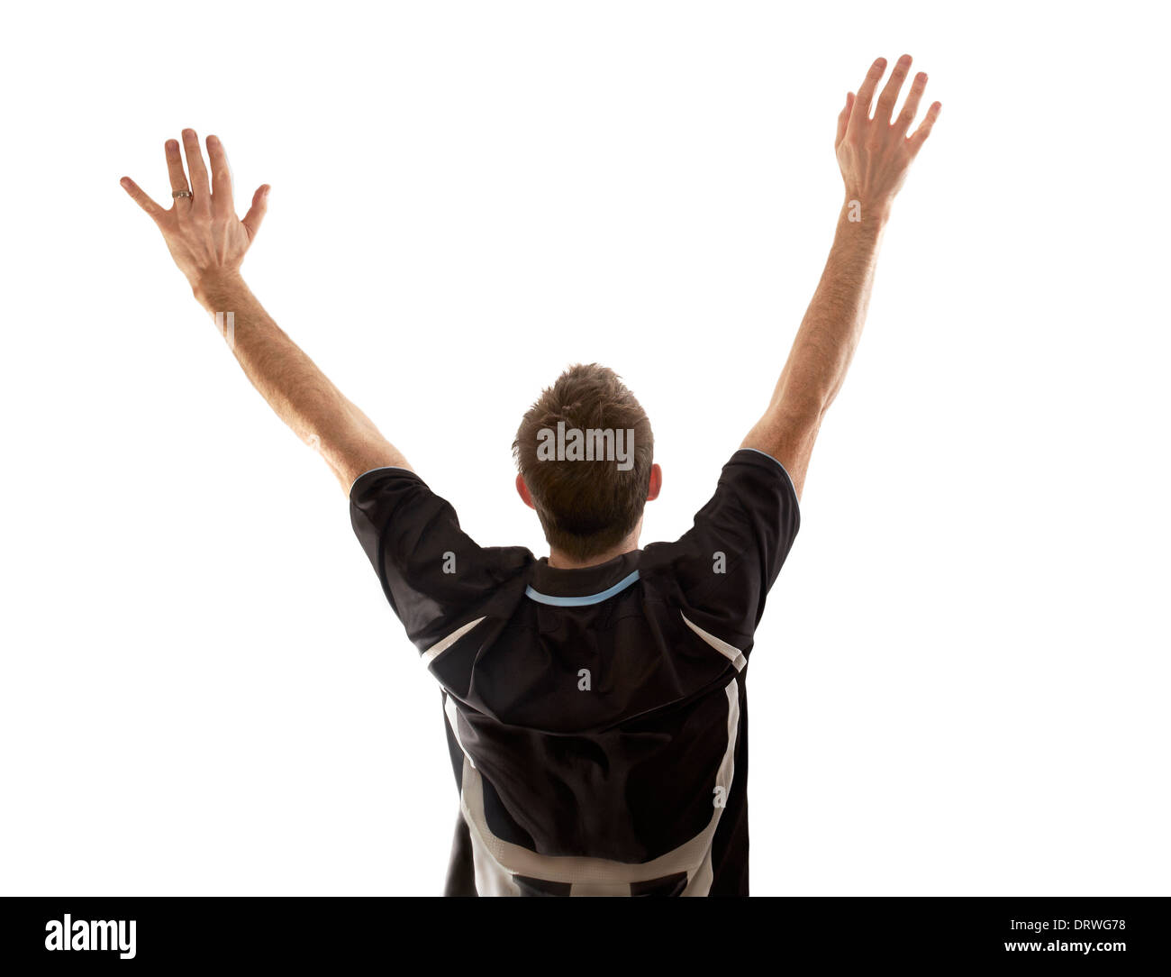 A man celebrating a goal at a football match on a white background. Stock Photo