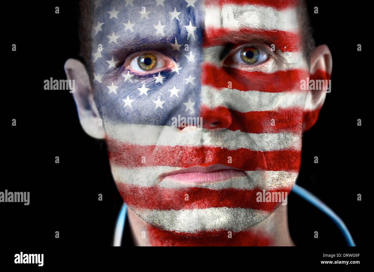 An intense stare from a football fan with their face painted with the American flag. Stock Photo