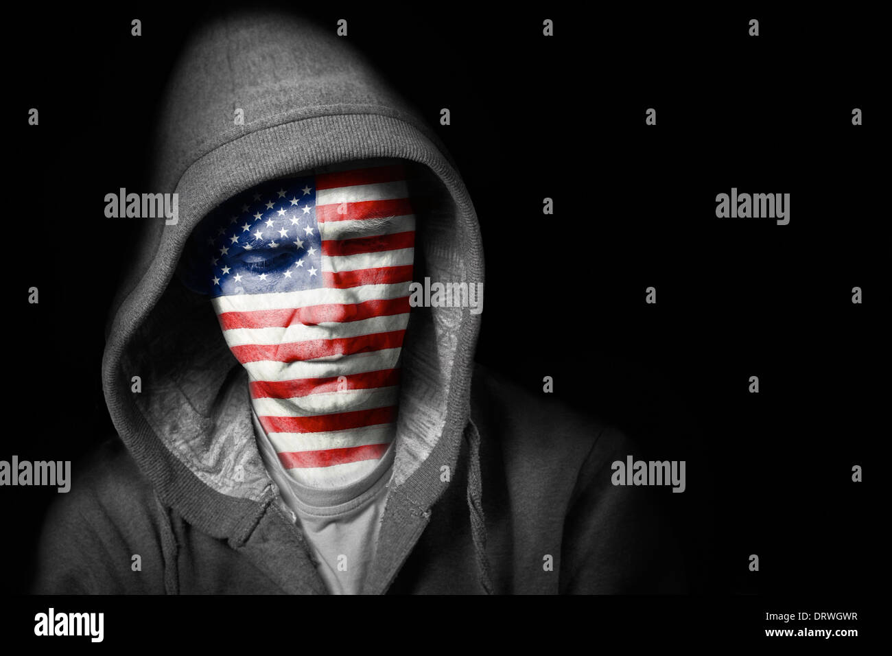 A sad expression on the face of a football fan with their face painted with the American flag. Stock Photo