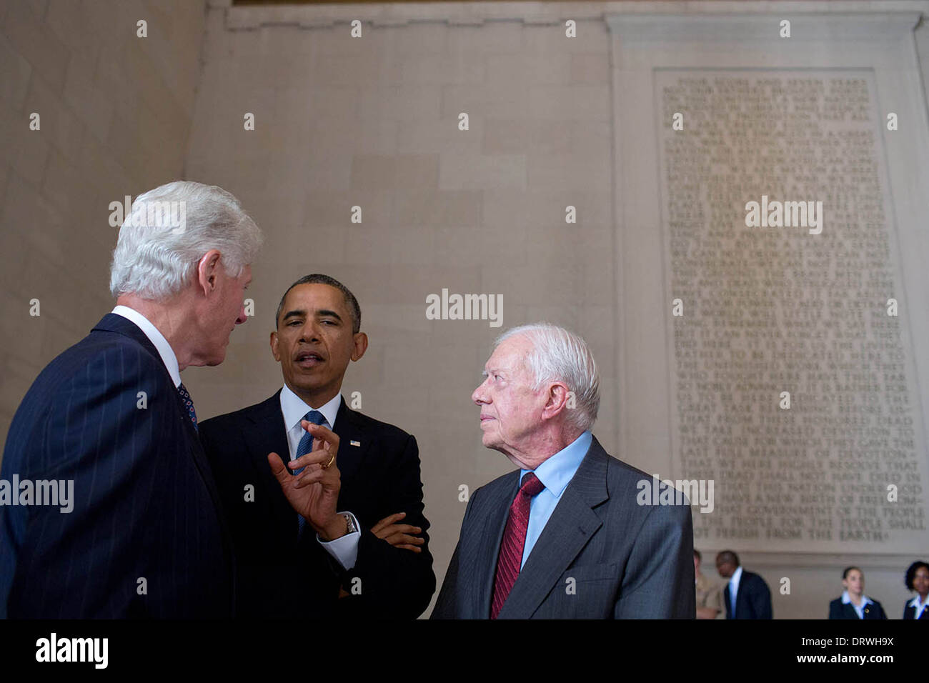 US President Barack Obama talks with former Presidents Bill Clinton and Jimmy Carter prior to the Let Freedom Ring ceremony to commemorate the 50th anniversary of the historic March on Washington for Jobs and Freedom at the Lincoln Memorial August 28, 2013 in Washington, DC. Stock Photo
