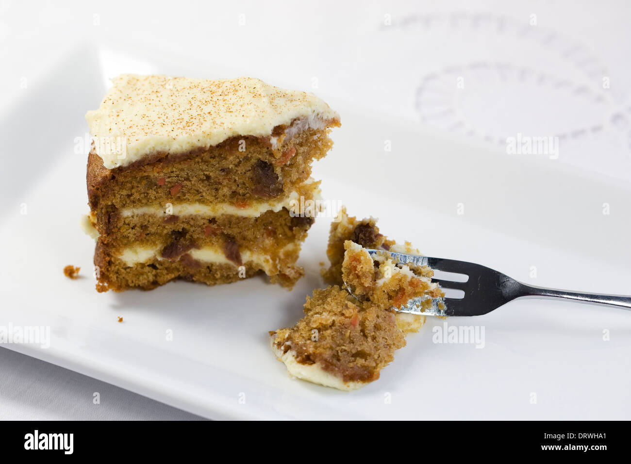 Homemade carrot cake on a white serving plate. Stock Photo
