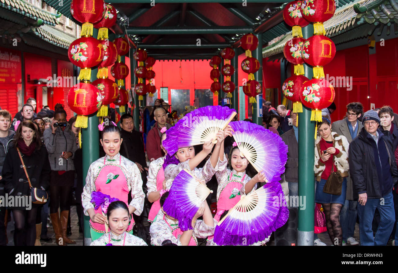 LONDON, UK, 2ND FEB 2014. Dancers performing for the Chinese New Year Celebration in London with spectactors watching them Stock Photo